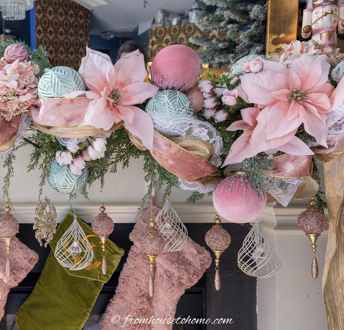 close up of a velvet ribbon and lace with pink flowers on a Christmas mantel garland
