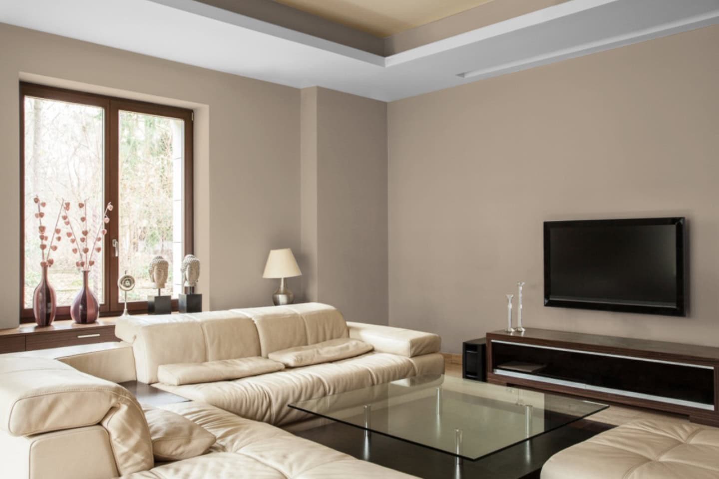 A living room painted in Sherwin Williams 2025 paint color of the year "Malabar"