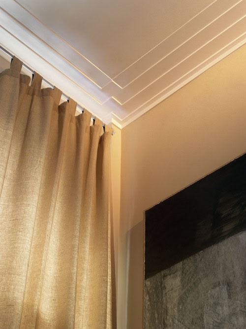 A close-up of Art Deco style crown molding on the ceiling