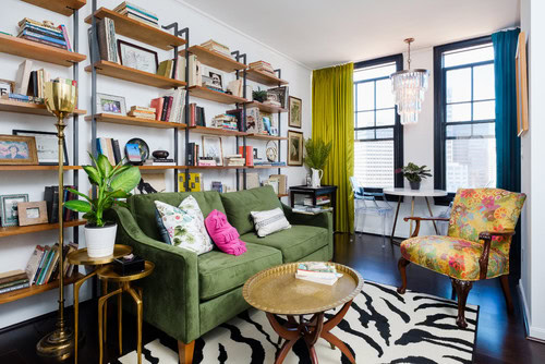 A wall-to-wall industrial book shelf in a living room