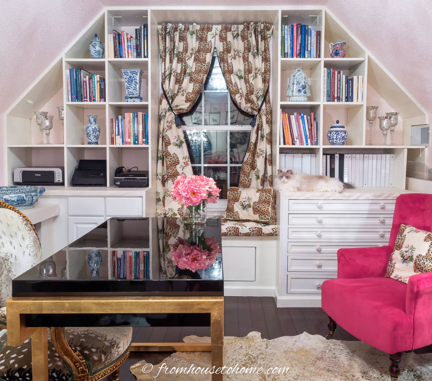 A bonus room wall with built-in bookshelves