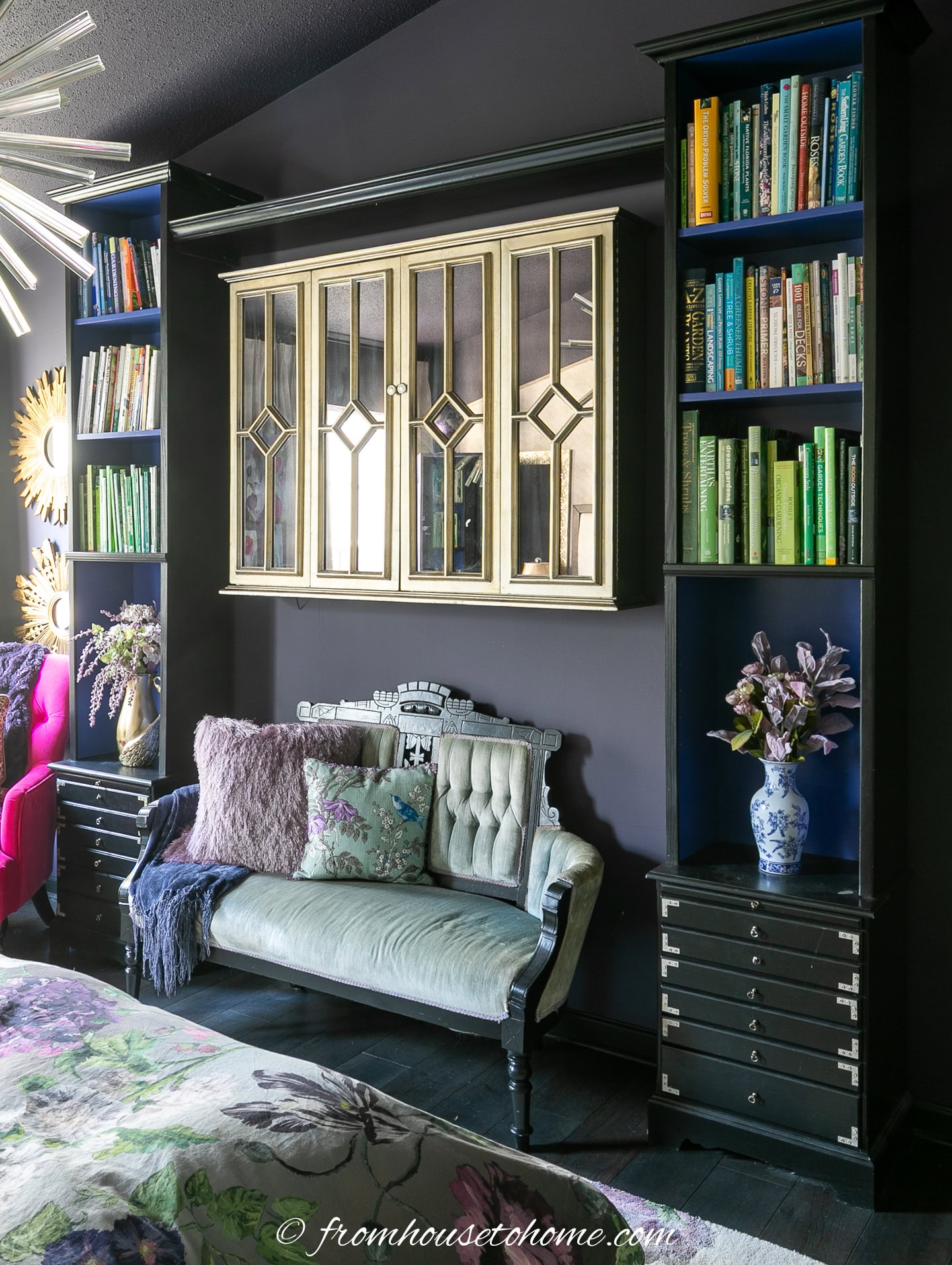 A bookshelf built over and around a settee