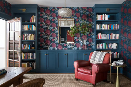 A library wall with base cabinets and a countertop in the middle