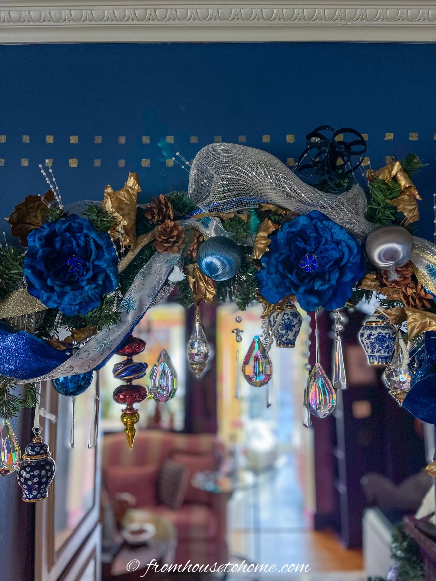 DIY crystal Christmas ornaments hanging from a doorway garland
