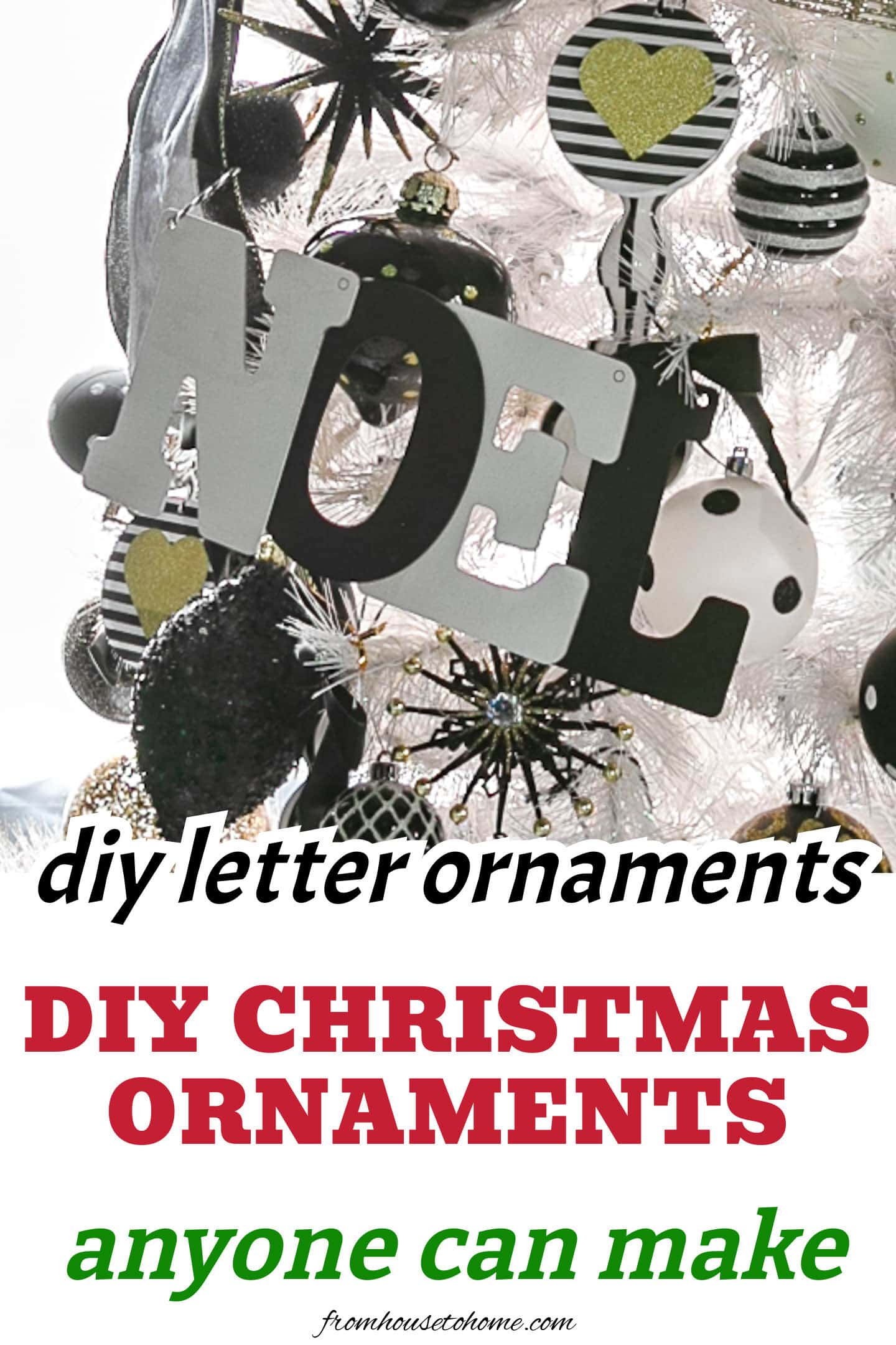 A black and white DIY letter ornament on a white Christmas tree