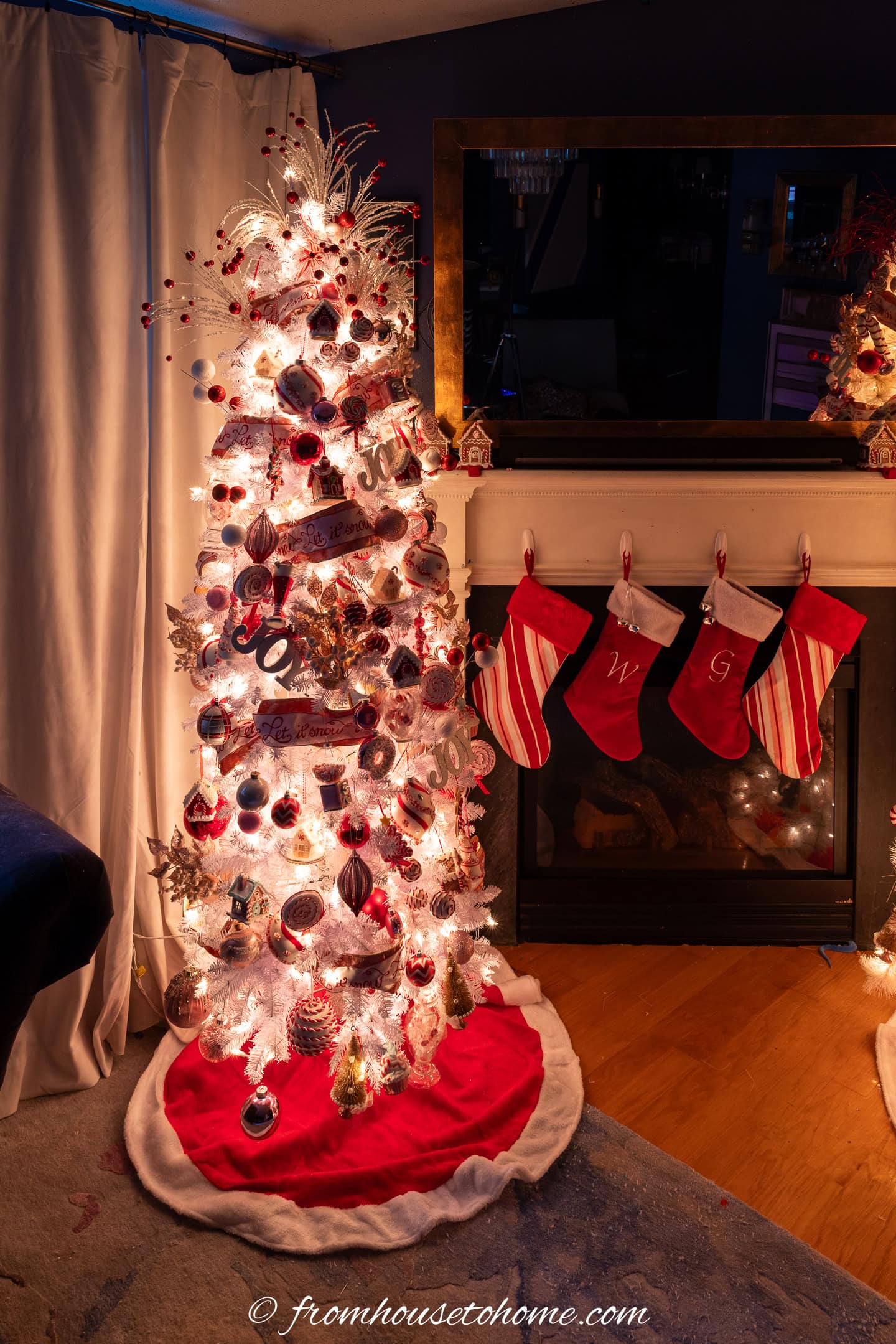 A candyland Christmas tree lit up at night