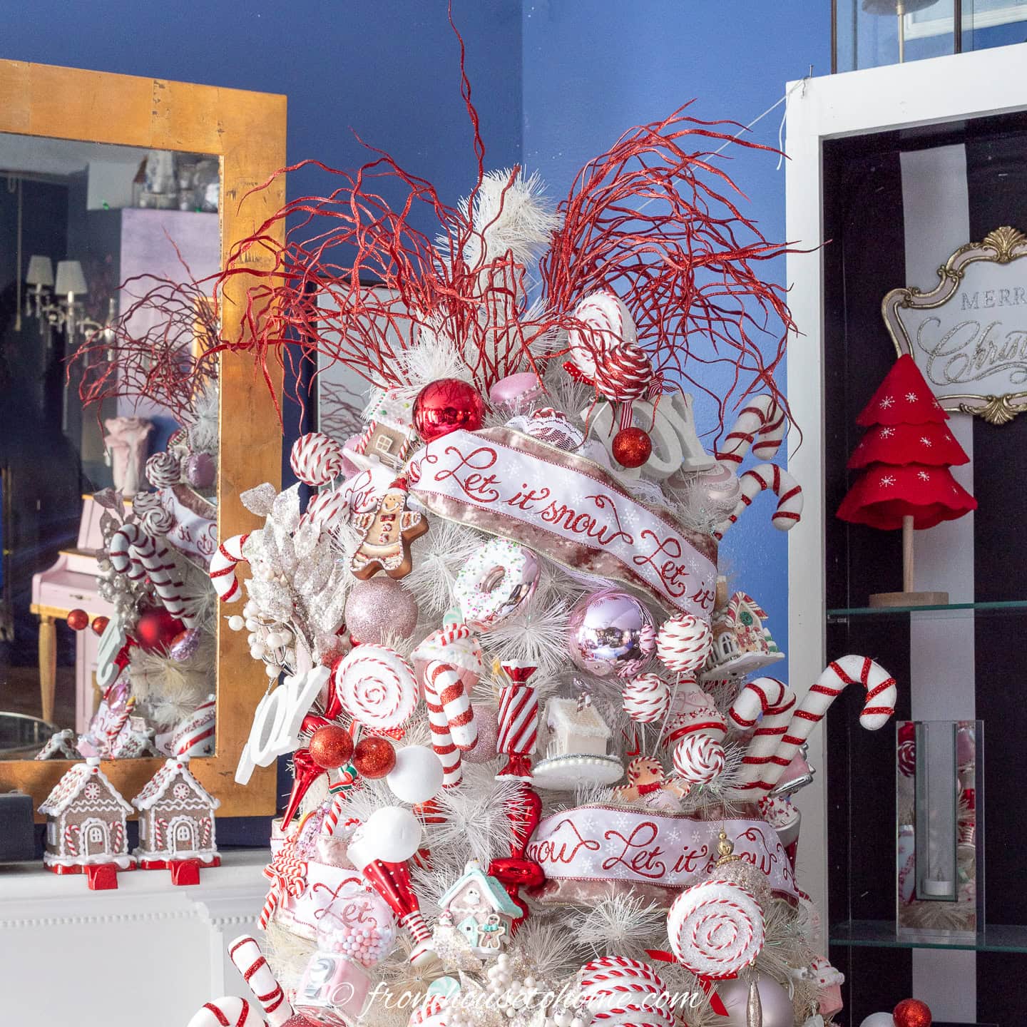 Red picks used as a tree topper for a candyland Christmas tree