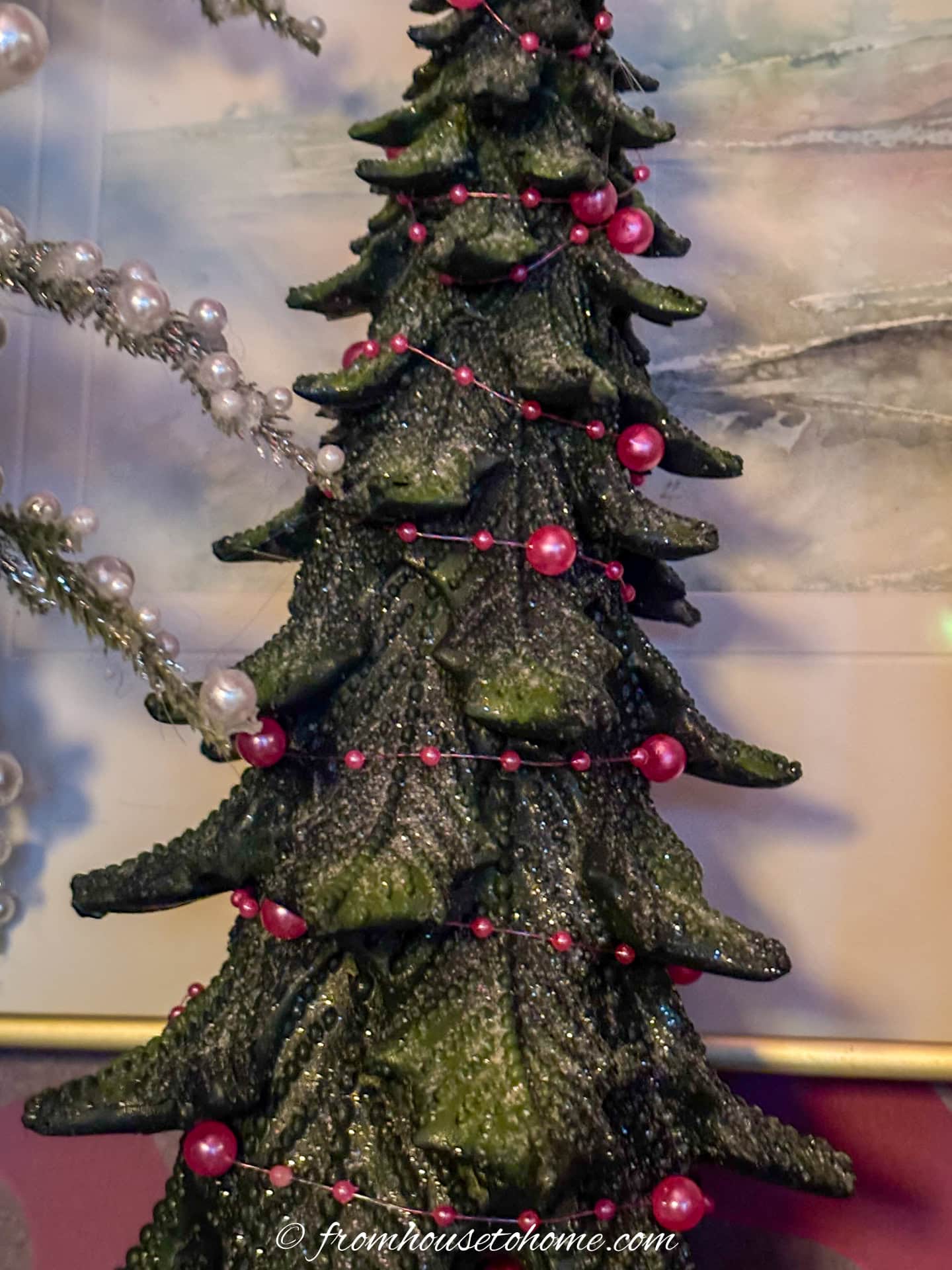 Mini Christmas tree wrapped with a pink pearl string