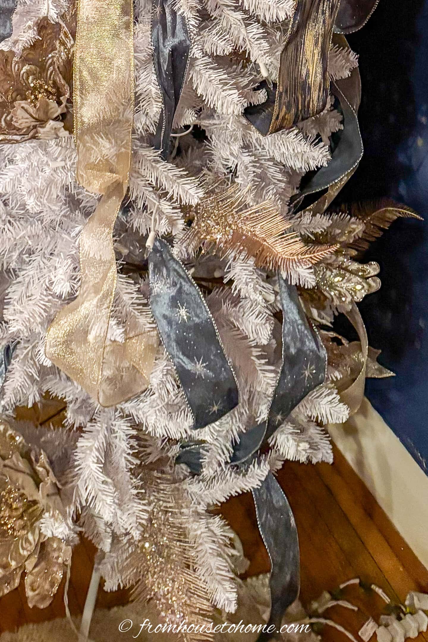 A close up of the end of the ribbons on a Christmas tree