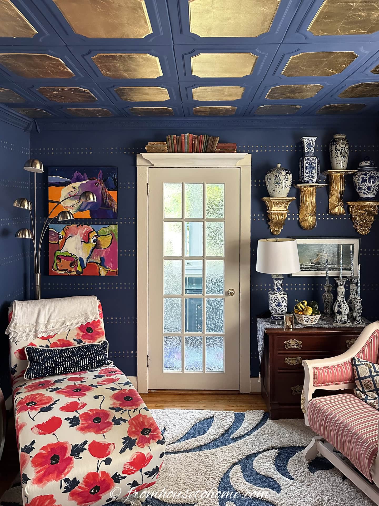 a blue and gold ceiling in a blue and white living room