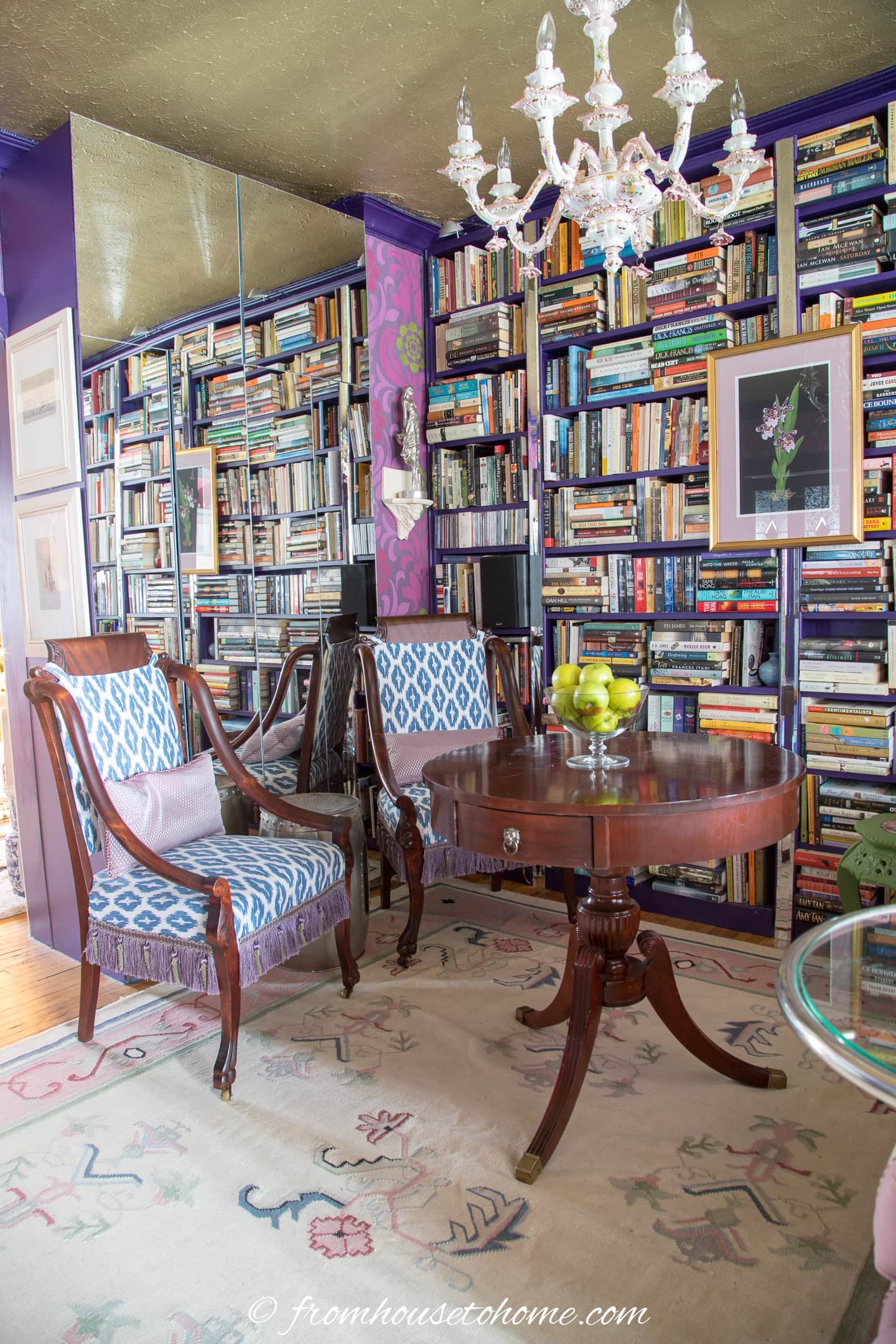 A small living room with a mirrored cabinet that makes the room look bigger