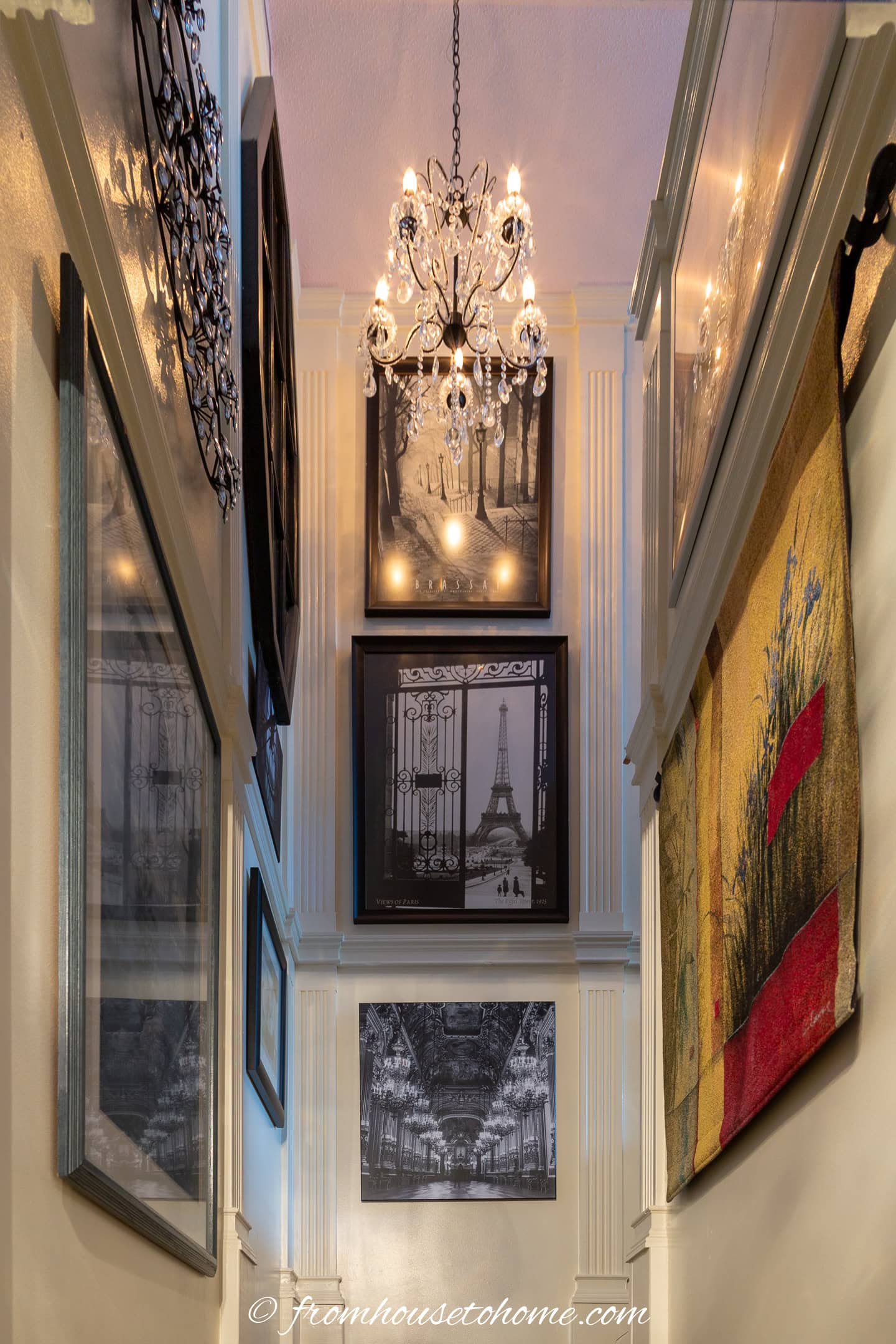 A large chandelier installed at the top of a tall stairwell