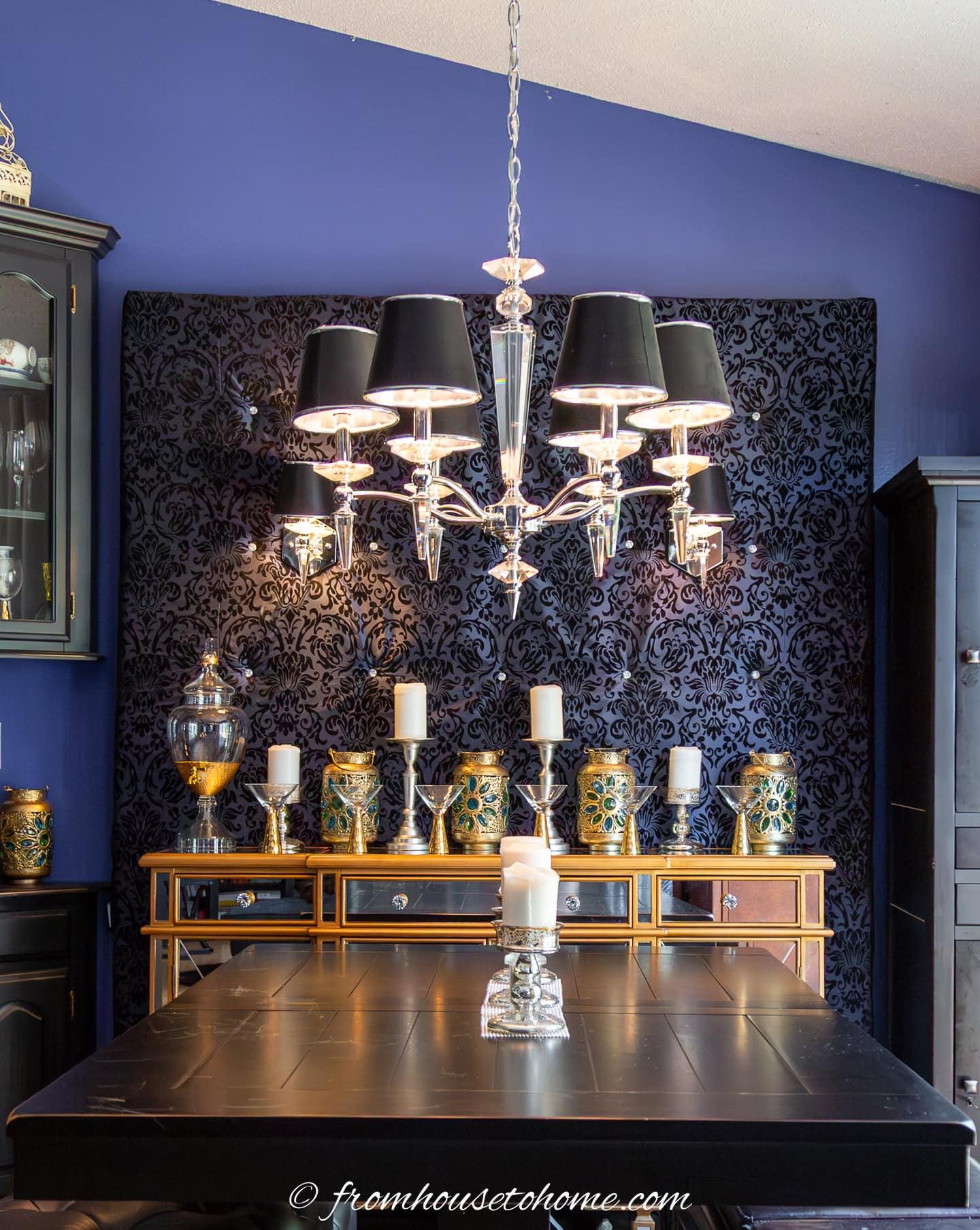 A modern chandelier over a dining room table