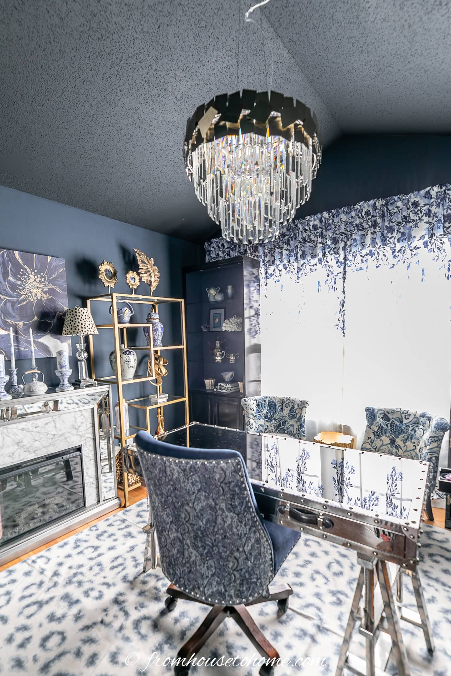 An art deco styled ceiling light fixture in a blue and white home office