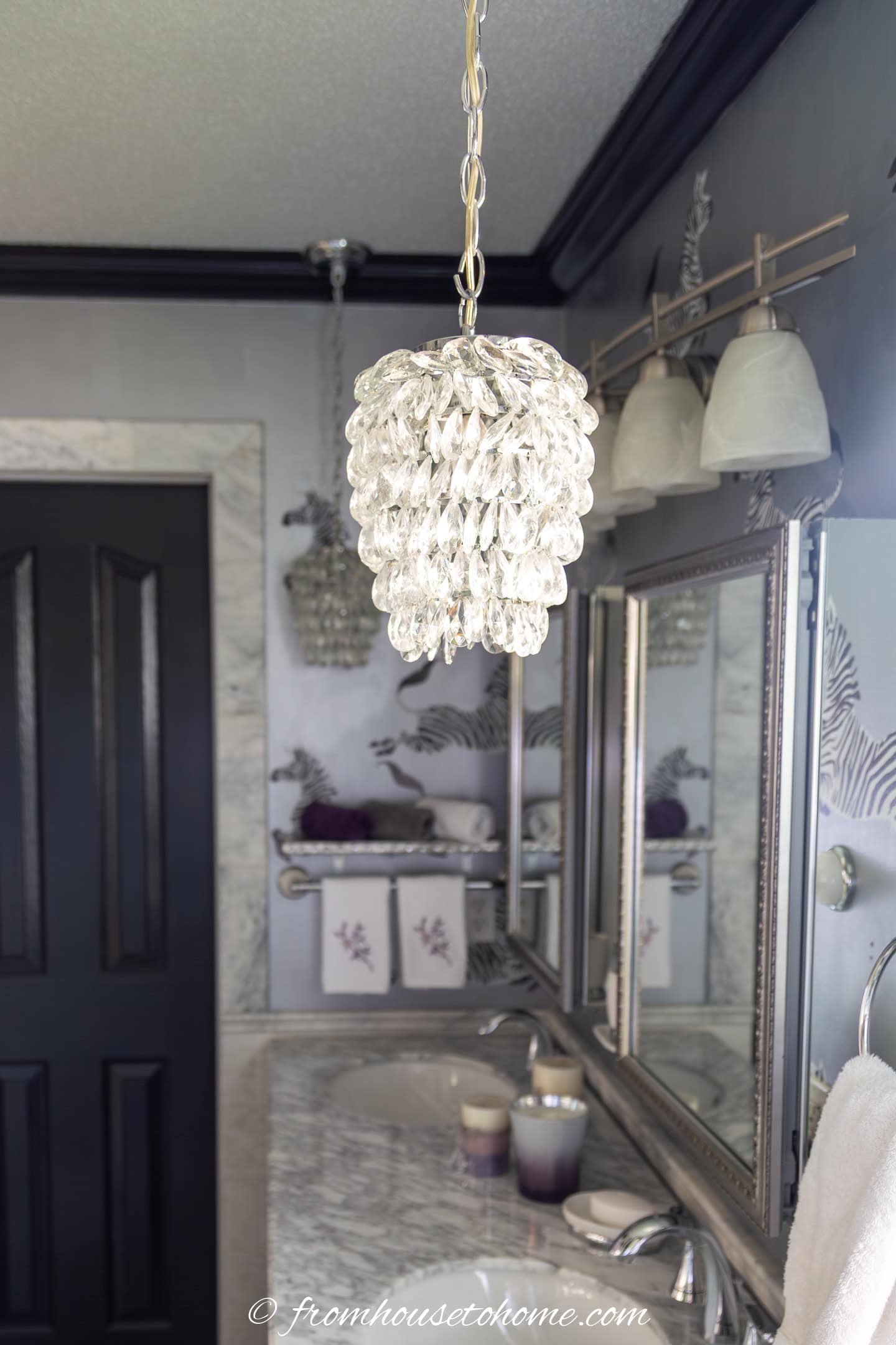 pendant light fixture hanging over a countertop in a bathroom