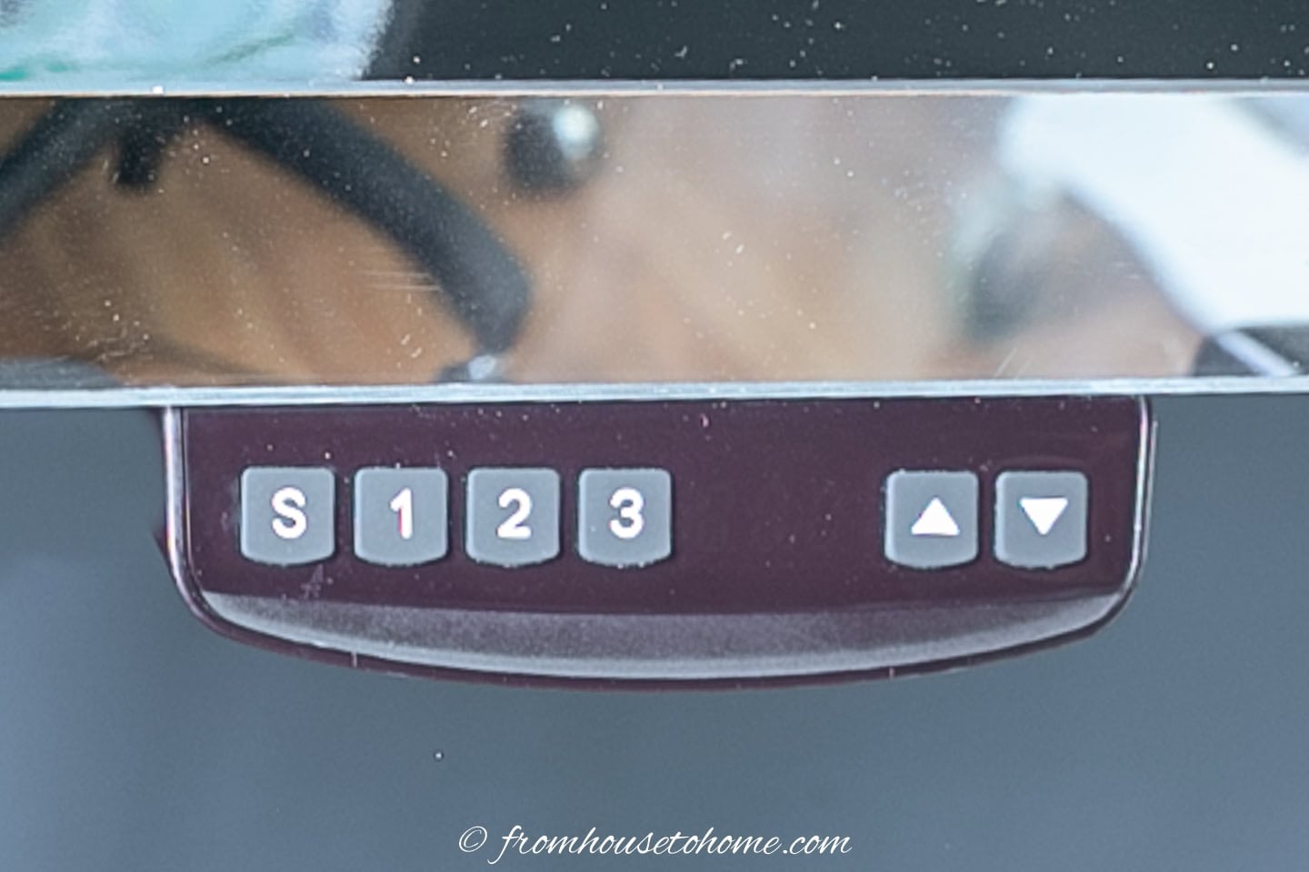 The controls that raise and lower the sit stand desk