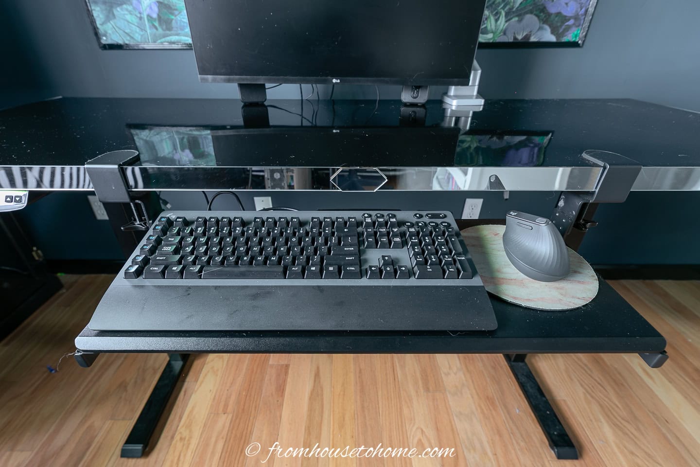 The keyboard tray attached to the front of the DIY sit stand desk