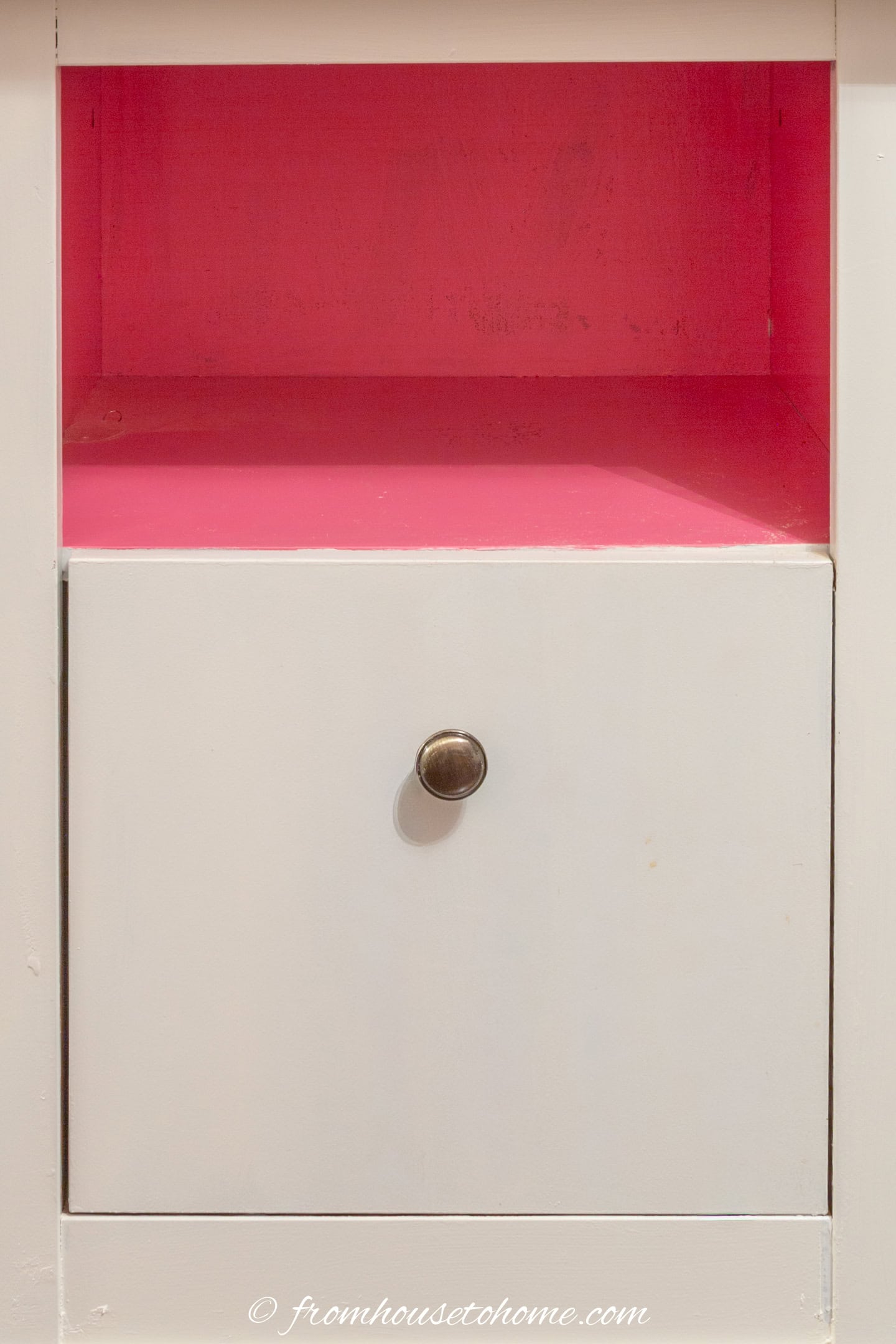 a filing cabinet with the interior painted bright pink