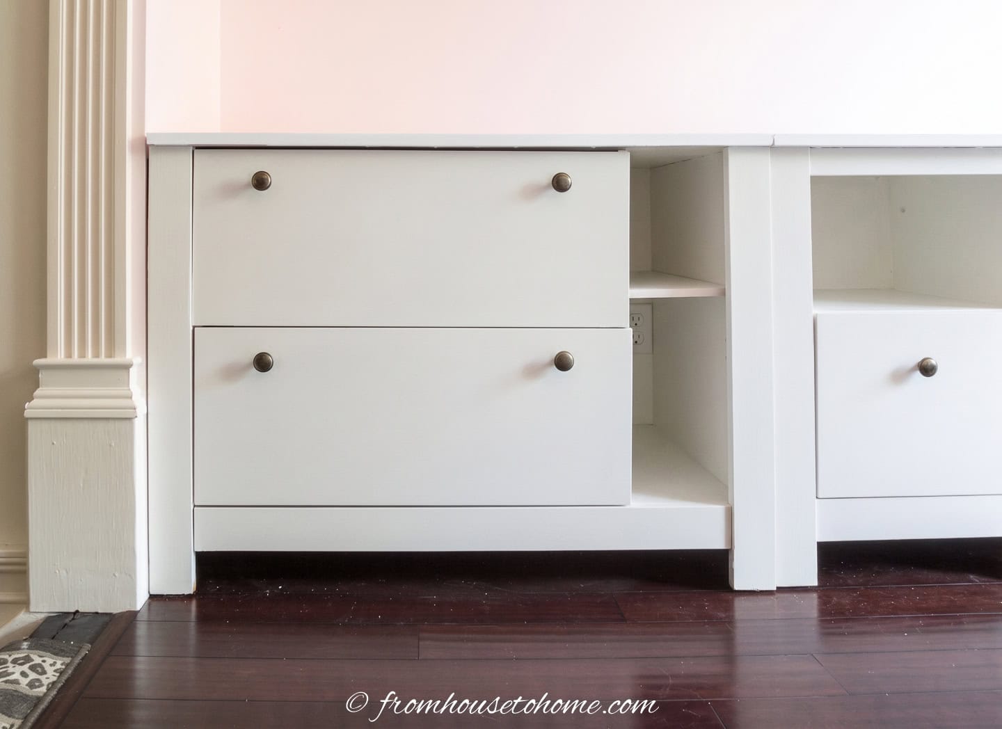 A laminate filing cabinet that has been painted white