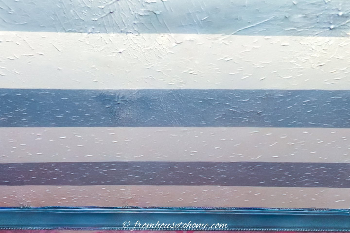 Blue stripes painted on an ivory background ceiling