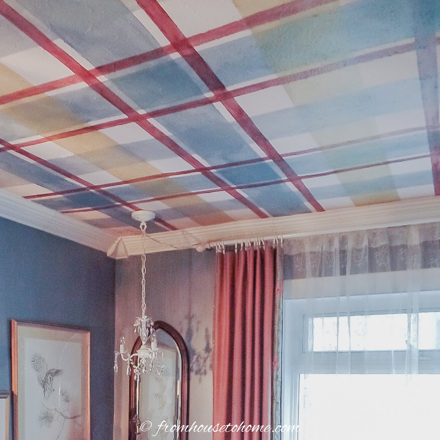 A plaid ceiling with blue, red and gold stripes