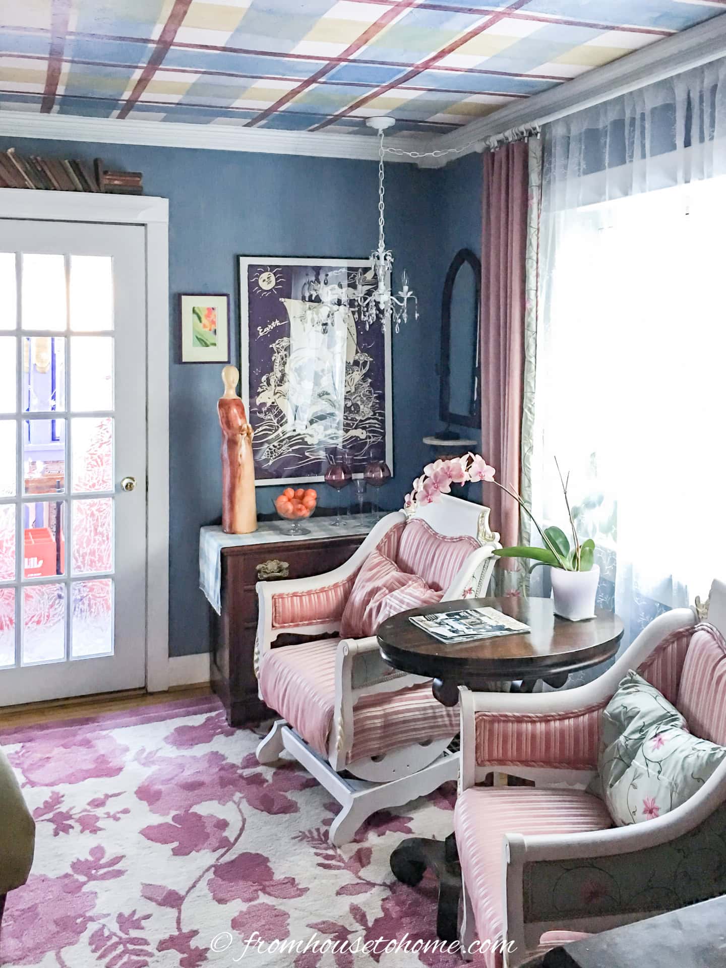 a living room with a blue, gold and red plaid ceiling