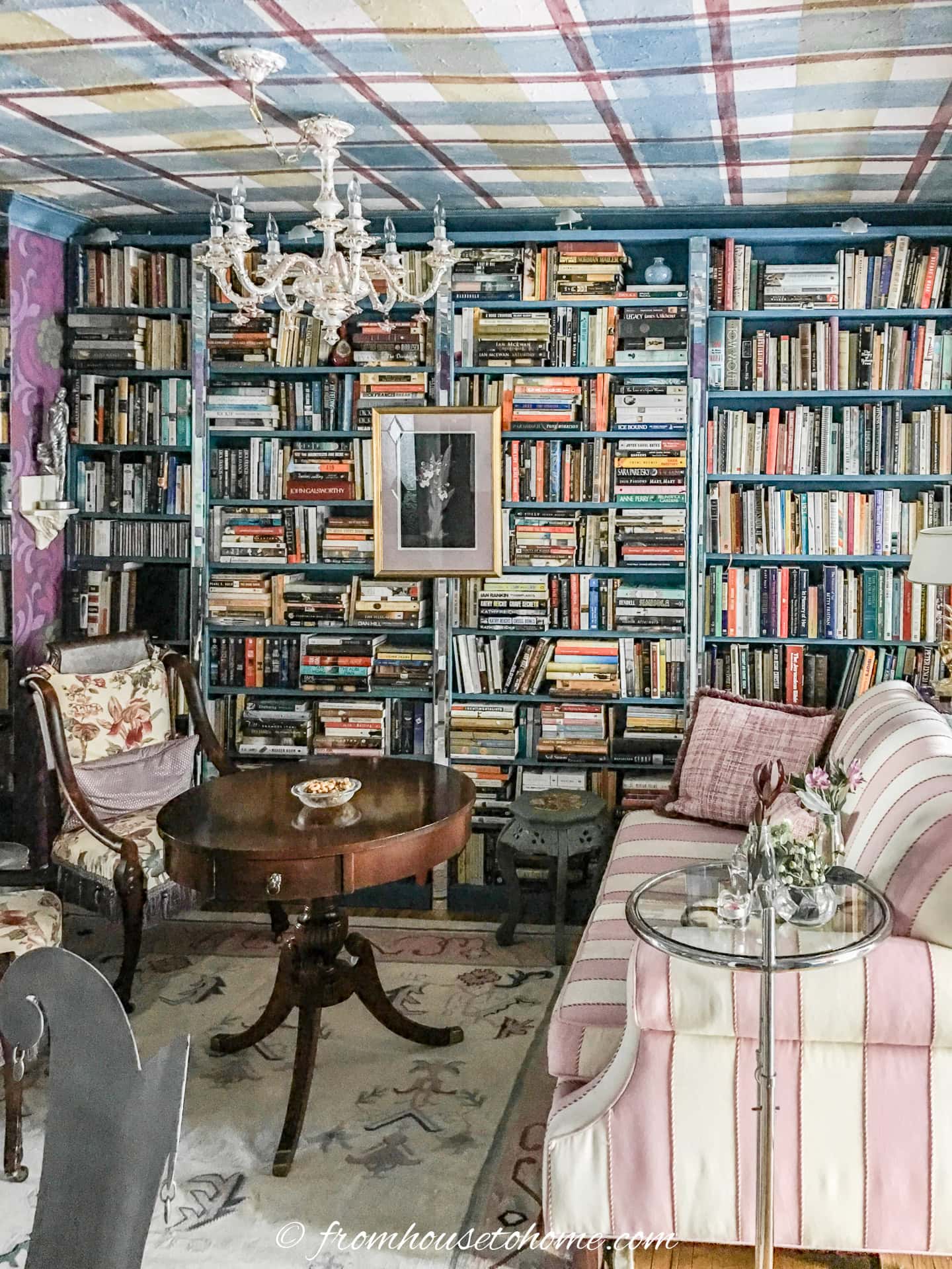 A home library with a painted plaid ceiling