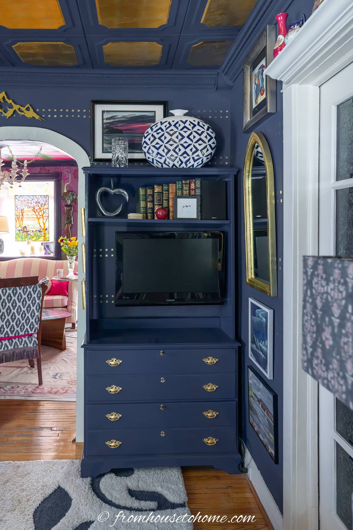 DIY navy blue painted bookshelves with gold hardware