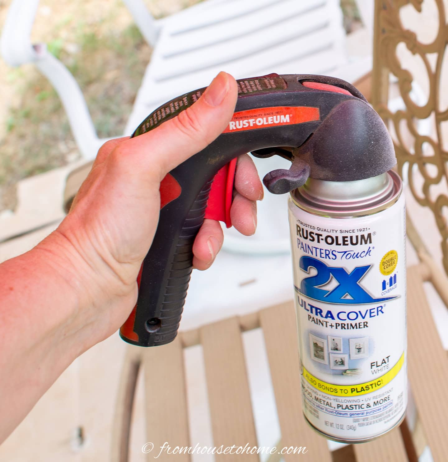 Close up of a paint can with a spray gun attached to the top of it