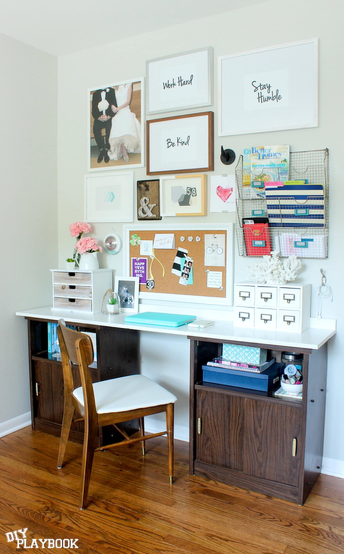Home office wall design with framed art, an organizer and bulletin board.
