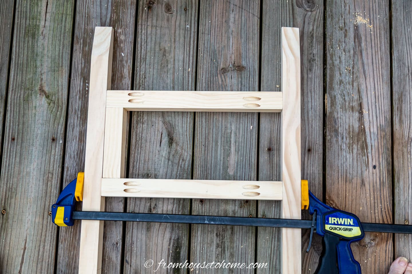 Use a clamp to keep the boards in place