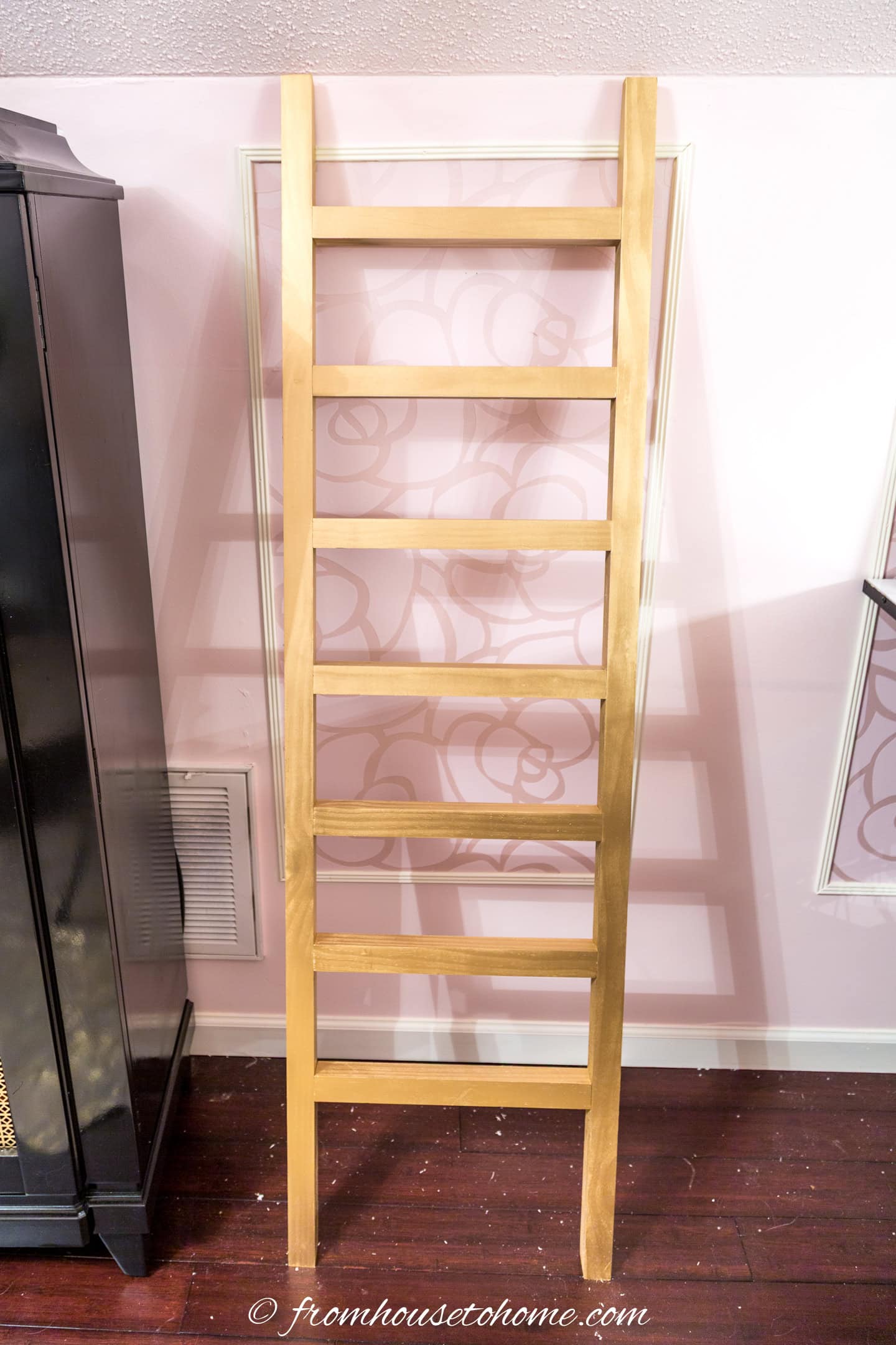 The finished DIY blanket storage ladder without any blankets