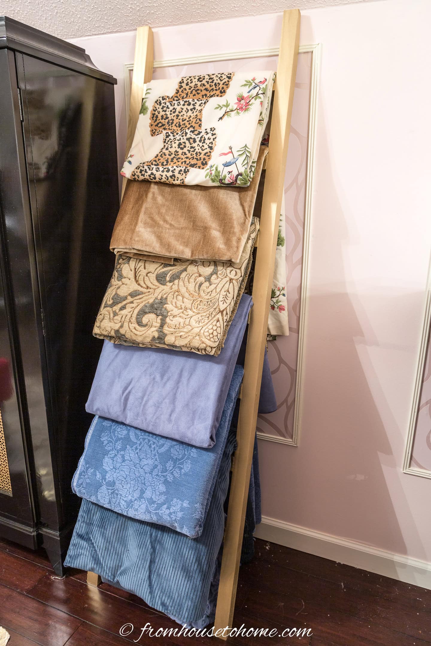 The finished blanket ladder with fabric on it.