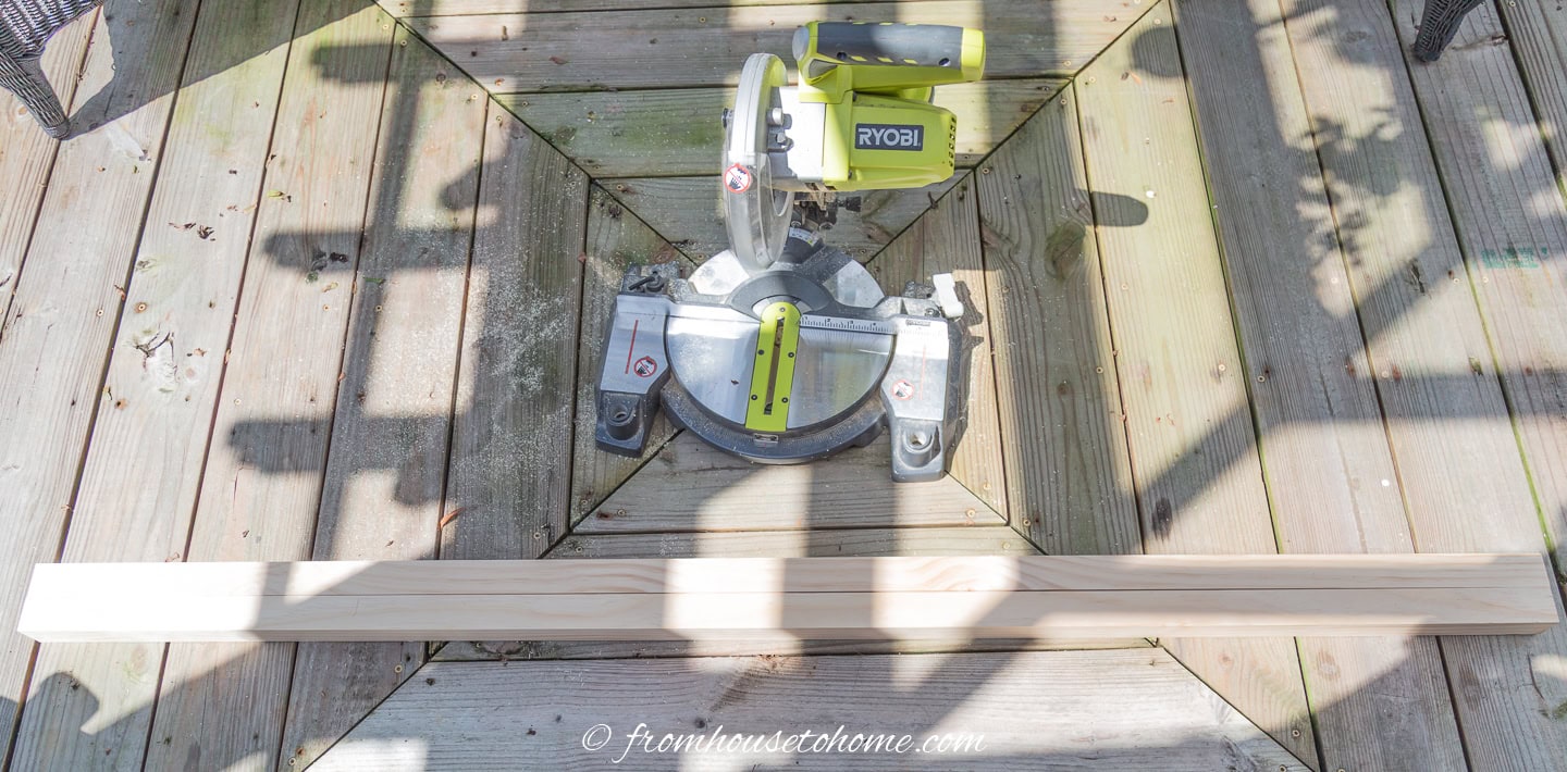Cut 2 boards the height of the ladder
