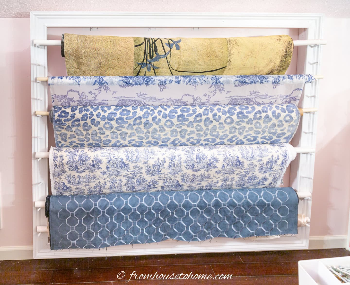 The finished fabric roll storage rack with rolls of fabric on it