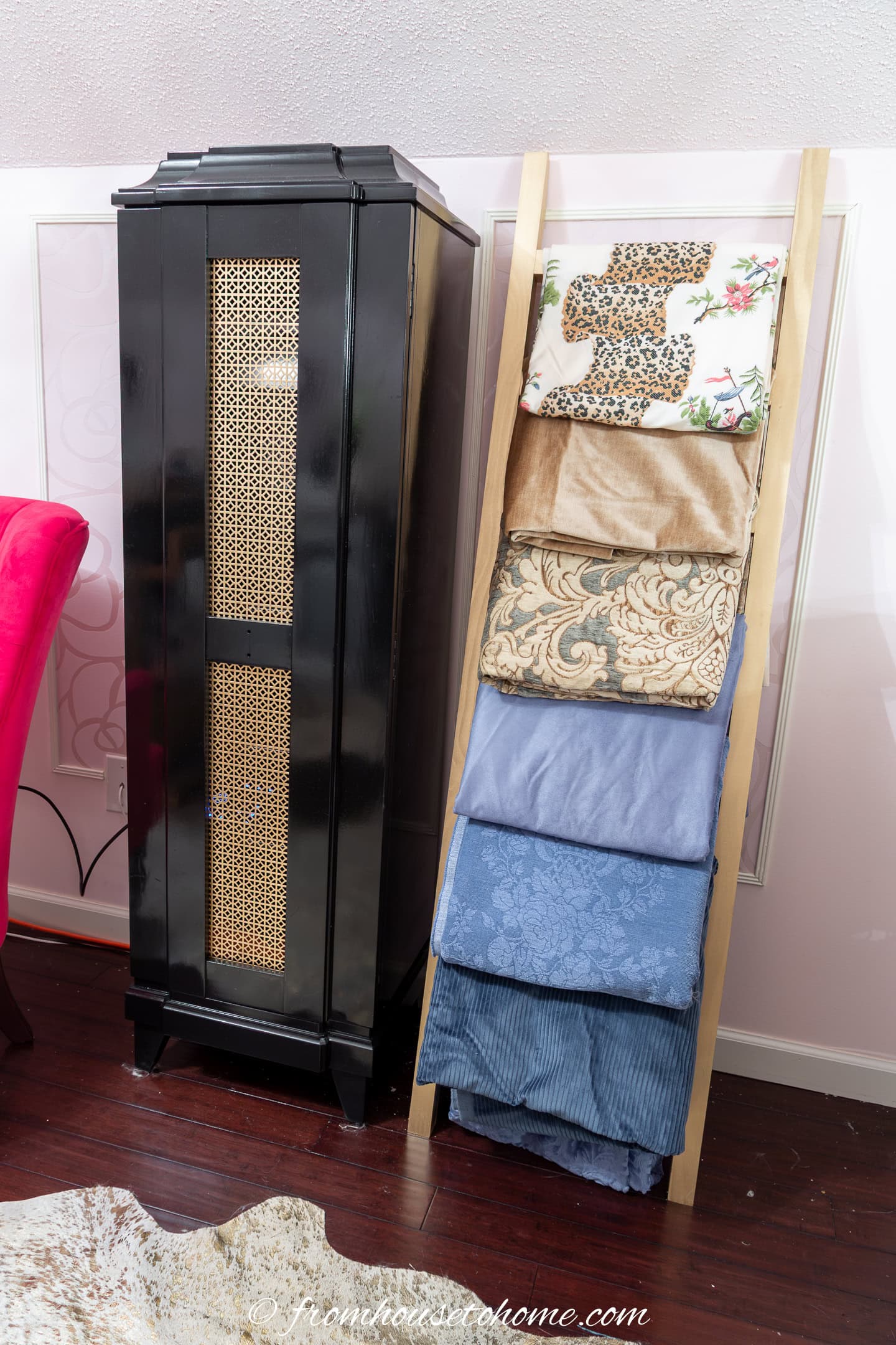 A decorative ladder used to store larger folded lengths of fabric