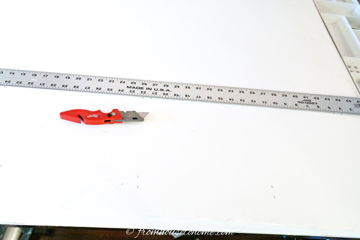 Use a utility knife and straight edge to cut the foam board
