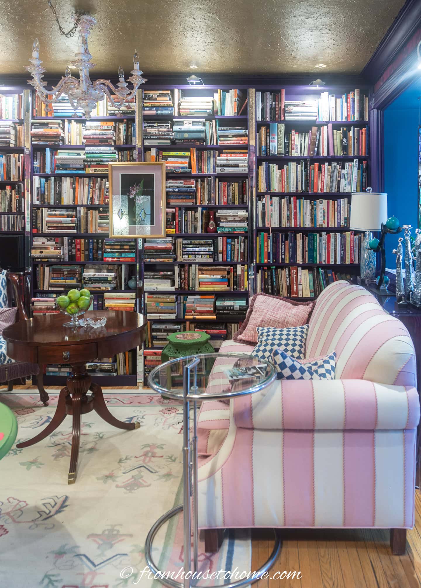 Wall to wall bookcases used as a living room accent wall