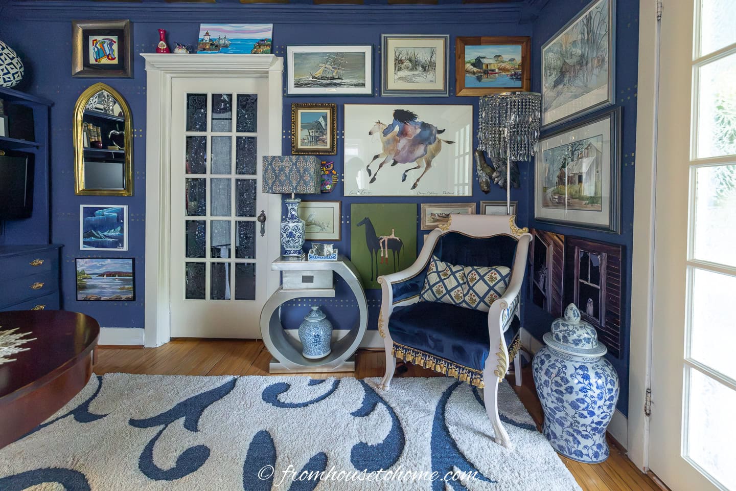 A floor to ceiling gallery wall in a living room