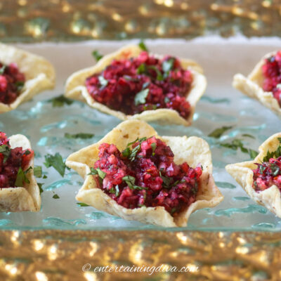 close up of cranberry salsa bites on a tray